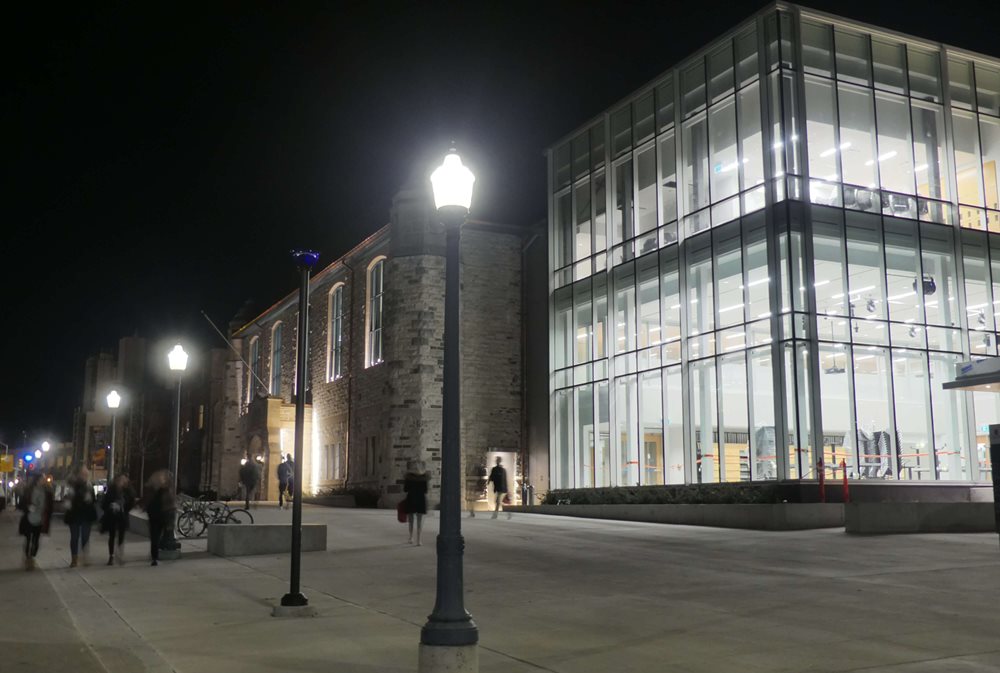 Queen's University Mitchell Hall exterior at night.